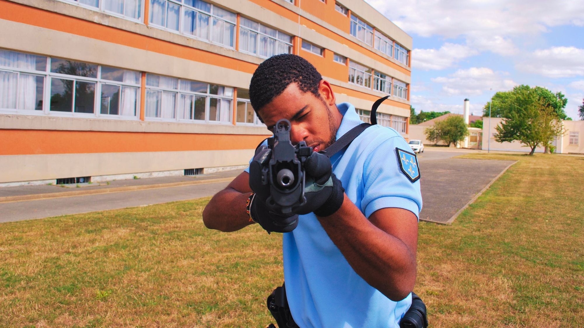 Axel Girier holding a 9mm submachine gun while in Gendarmerie