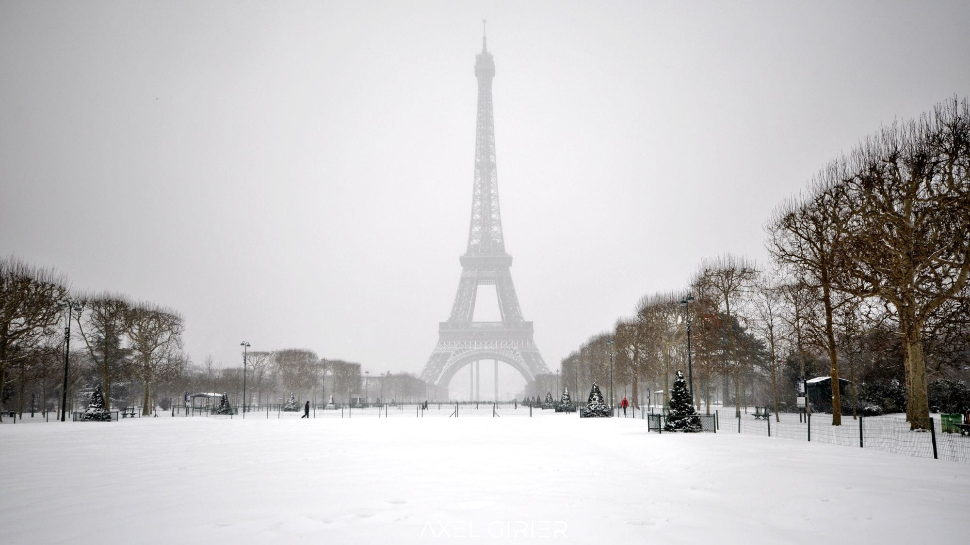 The Eiffel Tower and Paris in snow.